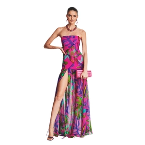 Detail view of the high side slit on a floral print strapless maxi dress for summer