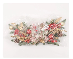 Detailed view of Christmas lintel wreath with pine cones and berries in plastic packaging