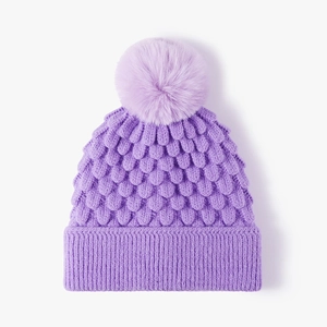 Women's thick purple cable knit beanie with faux fur pom pom and ribbed cuff