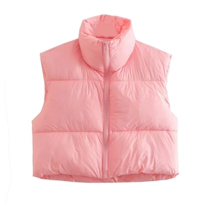 Close-up of pink puffer vest featuring a stand-up collar and matching zipper detail