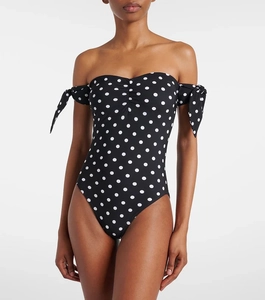 Close-up of off-the-shoulder polka dot swimsuit with ruched chest and bow-tie sleeves