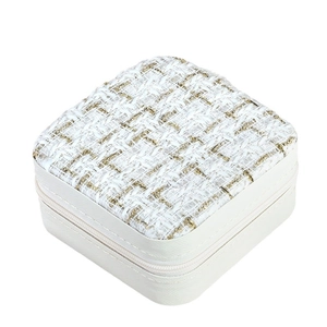Portable square jewelry box with tweed top and faux leather sides for travel rings