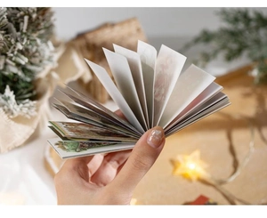 Close-up of Christmas gold foil washi stickers with vintage festive patterns