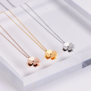 Three-layer clover pendant necklaces in gold, rose gold and silver with sandblasted finish