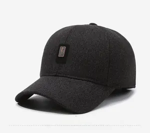 Detail of grey winter baseball cap featuring a premium wool texture and golf metal logo