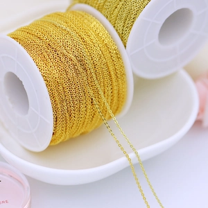 Close-up of 18K gold plated copper chain spools for DIY jewelry making projects