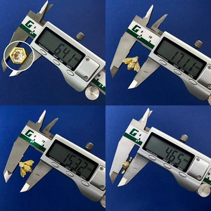 Macro view of bee earring dimensions showing diameter and thickness using digital calipers