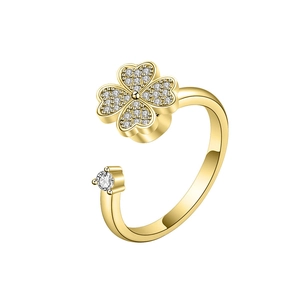 Rotating gold clover open ring with sparkling white zircon inlays and adjustable band