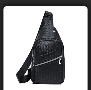 Close-up of black woven leather chest bag featuring adjustable strap and metallic zippers