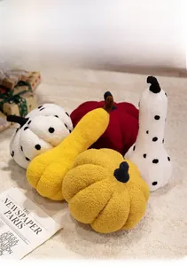Plush pumpkin pillows in various shapes and soft textures for home autumn decor