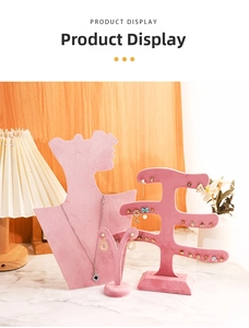 Detailed view of pink velvet jewelry display stands with bust and earring organizers