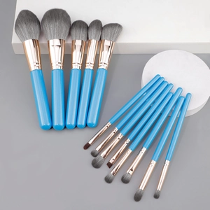 Professional 13-piece blue makeup brush set with soft synthetic bristles and rose gold ferrule