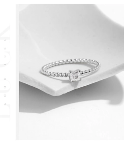 Detailed close-up of S925 silver beaded ring featuring a square-cut moissanite stone