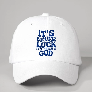White baseball cap featuring the printed IT'S NEVER LUCK IT'S ALWAYS GOD slogan
