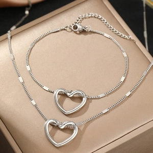 Minimalist stainless steel jewelry set with hollow heart necklace and bracelet