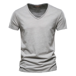 Macro shot of light gray slub cotton fabric and V-neckline on a casual men's summer t-shirt