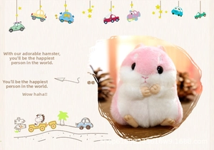 Close-up of soft pink and white plush hamster doll showing fluffy texture and cute pose