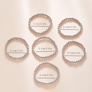 Detail showing set of silver beaded elastic rings with 5.1cm or 2.0in size measurement