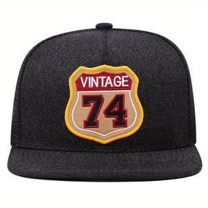 Vintage mesh trucker hat with shield embroidery and number 74 patch in black color