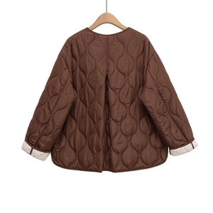 Brown quilted jacket with round neck and white cuff contrast, stylish back view