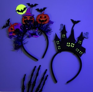 Detail of Halloween headbands featuring glitter pumpkin and glow-in-the-dark haunted castle