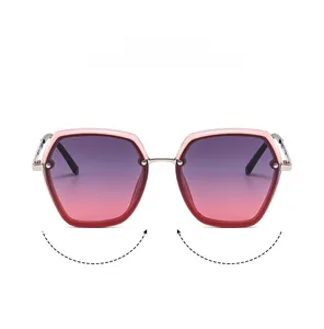 Detailed front view of pink pentagonal sunglasses with gradient purple lenses and silver bridge