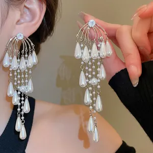 Elegant silver tassel earrings featuring sparkling zircon, fringe chains, and teardrop pearls