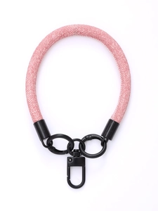 Short pink braided phone wrist strap with black metal rings and swivel hook detail