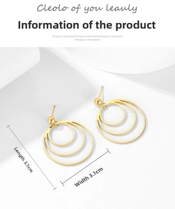 Detail of gold multi-layer wavy hoop earrings with 3.1cm dimensions and metallic texture