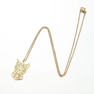 Detailed close-up of a gold-toned hollow cat head pendant on a thin link chain necklace