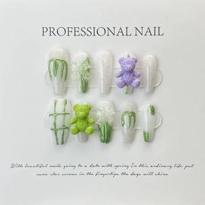 Detail of 3D bear charms and metallic lines on handmade glitter coffin press-on nails