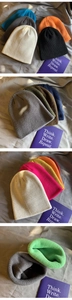 Close-up detail of textured knit ribbed fabric in various solid colors for beanies
