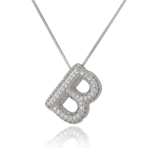 Macro shot of silver letter B pendant with white rhinestones and a box chain necklace