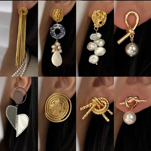 Collage of vintage gold and pearl earrings showing various luxury geometric designs