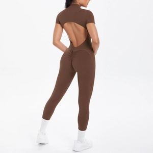 Close-up of the backless cutout and scrunch butt detail on dark brown yoga bodysuit