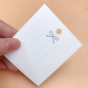 Minimalist white textured cardboard jewelry display card for hair clips and brooches
