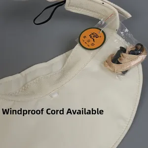 Detail of off-white sun hat showing the detachable windproof rope with adjustable buckle