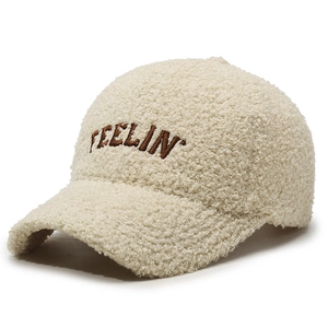Beige faux shearling baseball cap featuring Feelin' embroidery and warm teddy fleece texture