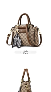 Detail of checkered tote bag featuring brown leather trim and a leopard print silk scarf