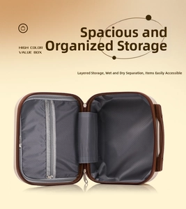 Internal view showing large storage capacity and mesh pocket of the pink 14-inch suitcase