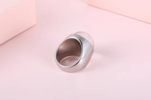 Detail of pink glass stone inlay on 304 stainless steel ring with smooth silver band