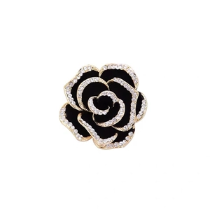Elegant black enamel rose brooch with gold-tone plating and sparkling crystal accents
