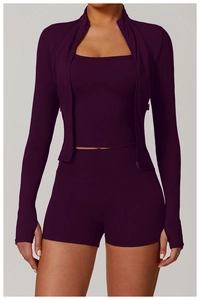 Detailed view of women's purple yoga jacket with full zipper and thumbhole cuffs
