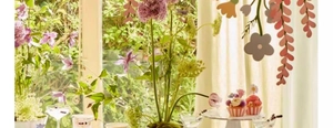 Close-up of double-sided floral banner decorations for festive spring window display