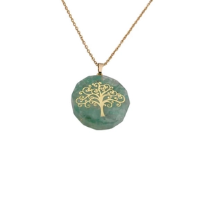 Detailed view of Tree of Life pendant with green natural stone and delicate gold chain