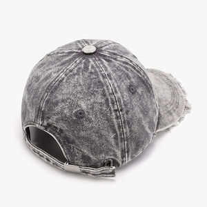 Distressed vintage washed baseball cap with frayed edges and adjustable metal buckle back