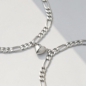 Polished silver stainless steel Figaro couple bracelets with heart magnetic clasp