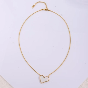 Detail of gold titanium heart necklace showing lobster clasp and S.steel engraving