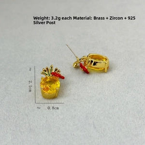 Macro shot of pineapple earrings featuring yellow zircon stones and silver needles