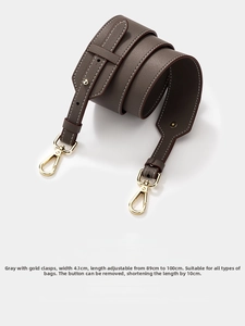 Adjustable gray cowhide leather shoulder strap with gold clasps and pebble texture